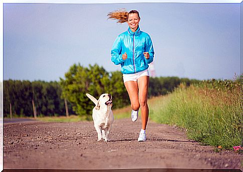 Dog and mistress running